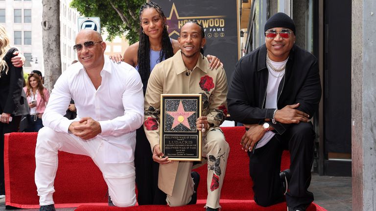 Rapper Ludacris poses with his daughter Karma Bridges, Vin Diesel and LL Cool J, as he unveils his star on the Hollywood Walk Of Fame, in Los Angeles, California, U.S. May 18, 2023. REUTERS/Mario Anzuoni