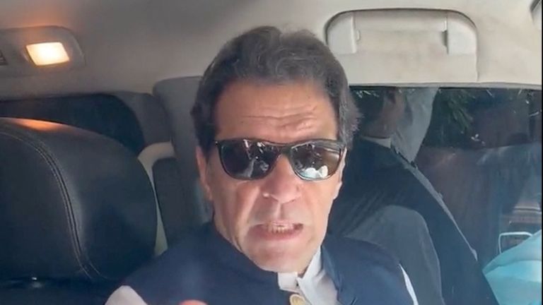 Former Pakistan Prime Minister Imran Khan gestures in a video statement