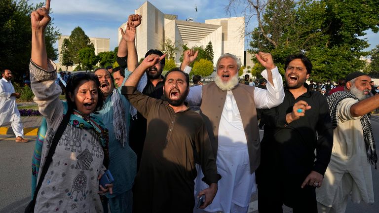 Supporters of Imran Khan chant slogans outside the Supreme Court after it ordered the release of the former prime minister Pic: AP 