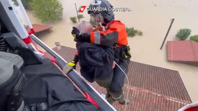Footage shows the Italian Coast Guard rescuing people from their rooftops amid deadly flooding.