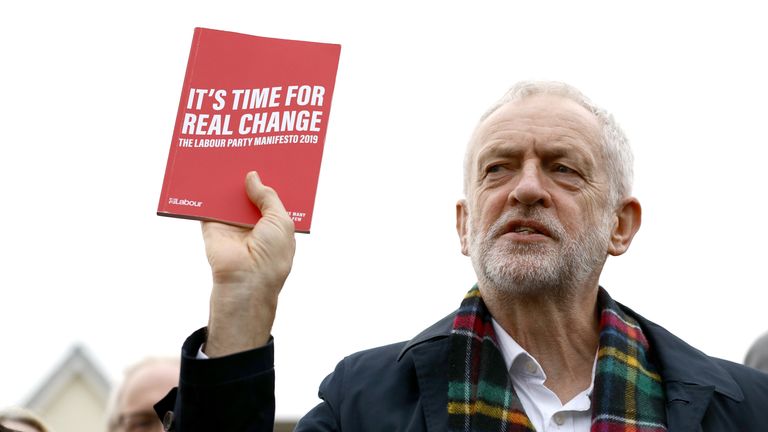 Labour Party leader Jeremy Corbyn, holds up his party&#39;s manifesto as he speaks to supporters during a visit to Thurrock in Essex whilst on the General Election campaign trail.
