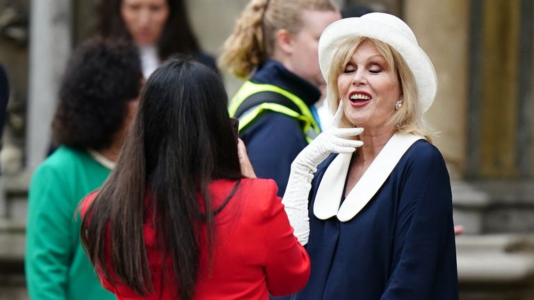 Dame Joanna Lumley poses for a photograph as she arrives ahead of the coronation ceremony of King Charles III and Queen Camilla at Westminster Abbey, London. Picture date: Saturday May 6, 2023.