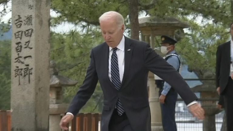 Joe Biden loses footing slightly on a flight of steps in Japan