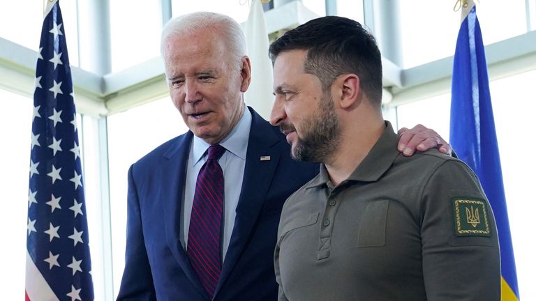 President Joe Biden, walks with Ukrainian President Volodymyr Zelenskiy ahead of a working session on Ukraine during the G7 Summit in Hiroshima, Japan, Sunday, May 21, 2023. Susan Walsh/Pool via REUTERS