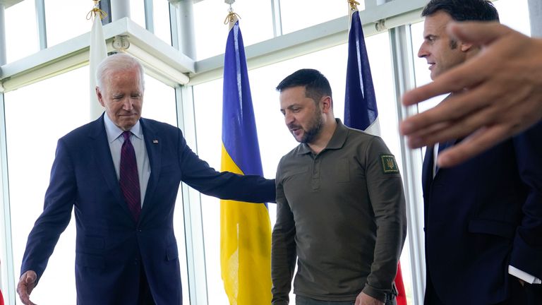 President Joe Biden, left, walks with Ukrainian President Volodymyr Zelenskyy. Pic: AP