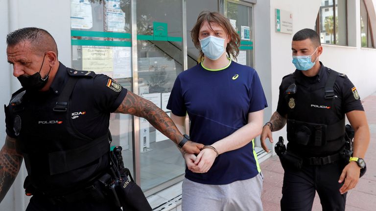British citizen Joseph James O&#39;Connor is lead by Spanish police officers as he leaves a court in July 2021