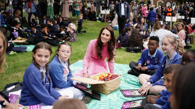 Britain&#39;s Kate, Princess of Wales talks with pupils from schools taking part in the first Children&#39;s Picnic at the RHS Chelsea Flower Show, at the Royal Hospital Chelsea, London, Monday May 22, 2023. (Jordan Pettitt/Pool via AP)