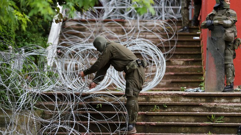 KFOR soldiers place a barbed wire in front of the city hall in the town of Zvecan, northern Kosovo
Pic:AP