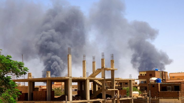 Smoke rises above buildings after an aerial bombardment, during clashes between the paramilitary Rapid Support Forces and the army in Khartoum North, Sudan 