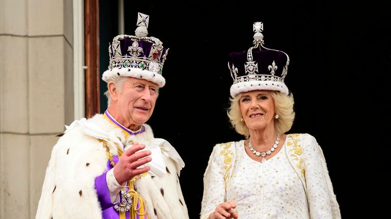  King Charles III and Queen Camilla stand on the balcony of the Buckingham Palace after their coronation, in London, Saturday, May 6, 2023. (Leon Neal/Pool Photo via AP)