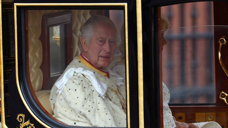 The Diamond Jubilee Coach carries the King and Queen