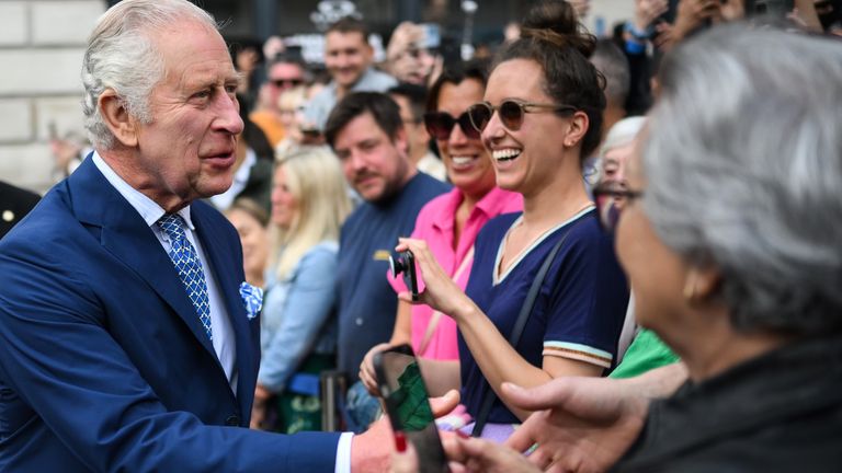 King Charles III speaks to members of the public during a visit with Queen Camilla to Covent Garden, London. Picture date: Wednesday May 17, 2023.
