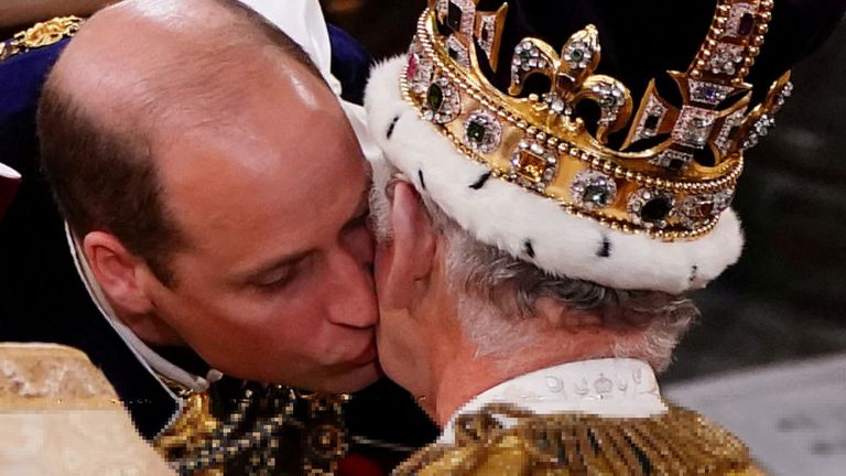 Britain's William, the Prince of Wales kisses his father King Charles III during his coronation ceremony in Westminster Abbey, London. Picture date: Saturday May 6, 2023. Yui Mok/Pool via REUTERS TPX IMAGES OF THE DAY