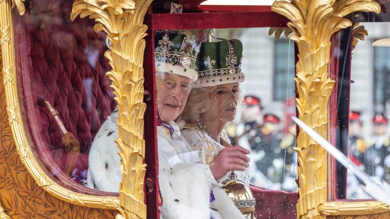 King Charles and Queen Camilla leave Westminster Abbey after his coronation, 6 May 2023. Jack Hill/Pool via REUTERS