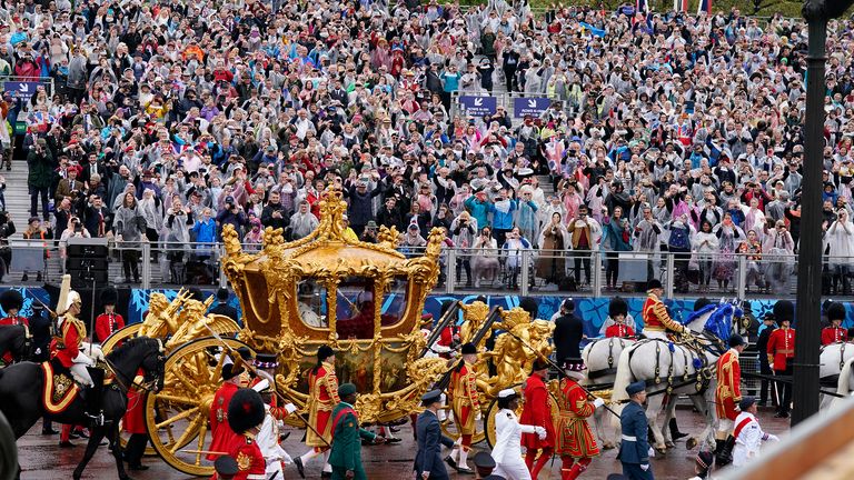 King Charles III and Queen Camilla are carried in the Gold State Coach, pulled by eight Windsor Greys, in The Coronation Procession as they return along The Mall to Buckingham Palace, London, following their coronation ceremony.  Picture date: Saturday May 6, 2023. PA Photo. See PA story ROYAL Coronation. Photo credit should read: Niall Carson/PA Wire
