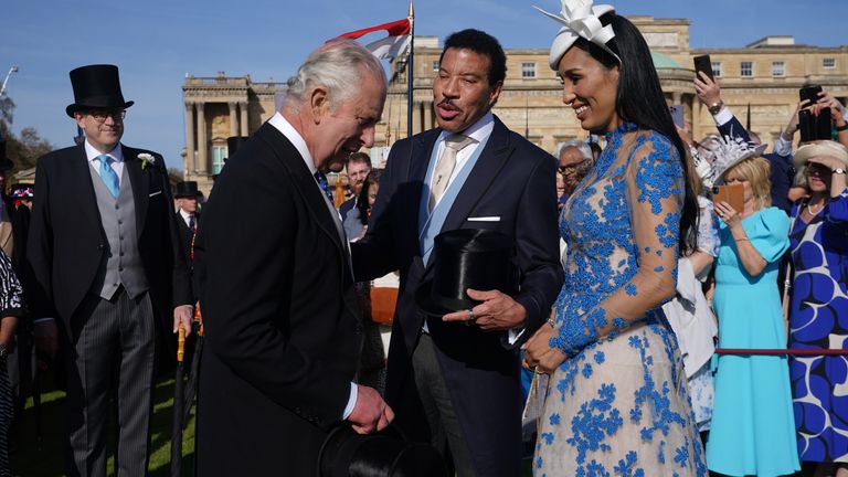 King Charles III speaks with Lionel Richie and Lisa Parigi during a Garden Party at Buckingham Palace, London, in celebration of the coronation on May 6. Picture date: Wednesday May 3, 2023.