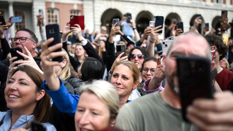 Members of the public await the arrival of King Charles III and Queen Camilla during a visit to Covent Garden, London. Picture date: Wednesday May 17, 2023. PA Photo. See PA story ROYAL King. Photo credit should read: Daniel Leal/PA Wire