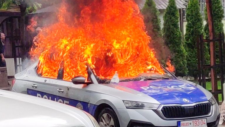 In this image made from video, Kosovar police car burns in Zvecan, northern Kosovo Friday, May 26, 2023. Serbia put its troops on the border with Kosovo on the highest state of alert Friday following clashes between ethnic Serbs and Kosovo police that left more than a dozen injured on both sides. (AP Photo)