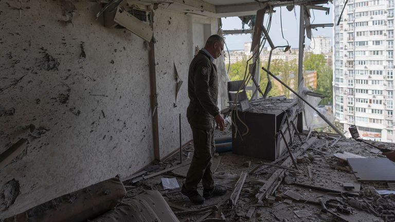 Kyiv Mayor Vitali Klitschko reacts standing in a Kyiv apartment building damaged by a drone shot down in a Russian strike