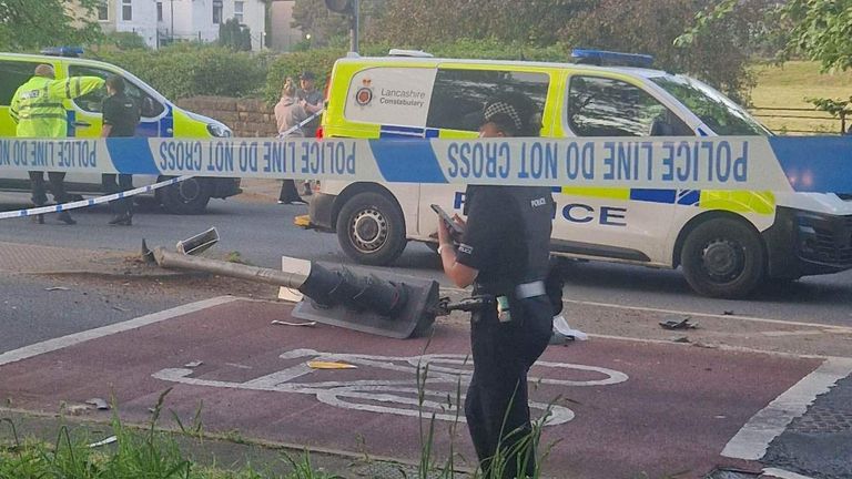 Police at the scene of a crash in which a police vehicle hit a boy, 11, in the Lancaster area on 25 May