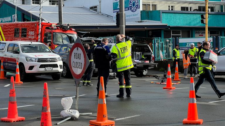 Fire and emergency crews work at the scene of a fire at the Loafers Lodge, in Wellington, New Zealand 