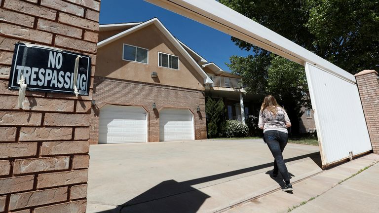 Briell Decker, the 65th wife of jailed Fundamentalist Church of Jesus Christ of Latter-Day Saints (FLDS Church) polygamist prophet leader Warren Jeffs, enters his compound, where he lived for several years, in Hildale, Utah, U.S., on May 3, 2017. She is in the process of purchasing the compound. Picture taken May 3, 2017. REUTERS/George Frey
