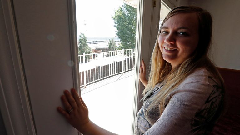Briell Decker, the 65th wife of jailed Fundamentalist Church of Jesus Christ of Latter-Day Saints (FLDS Church) polygamist prophet leader Warren Jeffs, looks out the window of one of the 41 bedrooms at his compound, where he lived for several years, in Hildale, Utah, U.S., May 3, 2017. She is in the process of purchasing the compound. Picture taken May 3, 2017. REUTERS/George Frey 