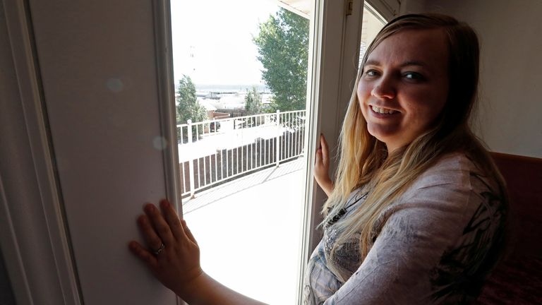 Briell Decker, the 65th wife of jailed Fundamentalist Church of Jesus Christ of Latter-Day Saints (FLDS Church) polygamist prophet leader Warren Jeffs, looks out the window of one of the 41 bedrooms at his compound, where he lived for several years, in Hildale, Utah, U.S., May 3, 2017. She is in the process of purchasing the compound. Picture taken May 3, 2017. REUTERS/George Frey
