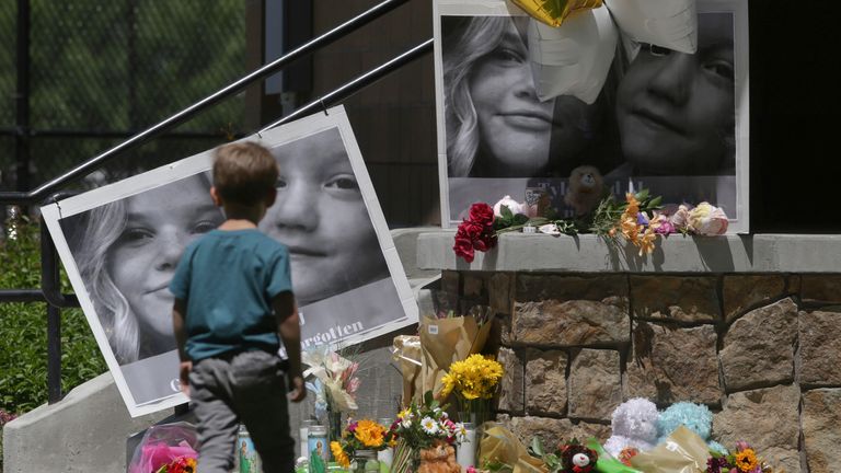 FILE - A boy looks at a memorial for Tylee Ryan and Joshua "JJ" Vallow in Rexburg, Idaho, on June 11, 2020. The sister of Tammy Daybell, who was killed in what prosecutors say was a doomsday-focused plot, told jurors Friday, April 28, 2023, that her sister&#39;s funeral was held so quickly that some family members couldn&#39;t attend. The testimony came in the triple murder trial of Lori Vallow Daybell, who is accused along with Chad Daybell in Tammy&#39;s death and the deaths of Vallow Daybell&#39;s two youngest children. (John Roark/The Idaho Post-Register via AP, File)