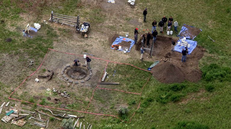 FILE - In this aerial photo, investigators search for human remains at Chad Daybell's residence in Salem, Idaho, on June 9, 2020. The sister of Tammy Daybell, who was killed in what prosecutors say was a doomsday-focused plot, told jurors Friday, April 28, 2023, that her sister's funeral was held so quickly that some family members couldn't attend. The testimony came in the triple murder trial of Lori Vallow Daybell, who is accused along with Chad Daybell in Tammy's death and the deaths of Vallow Daybell's two youngest children. (John Roark/The Idaho Post-Register via AP, File)