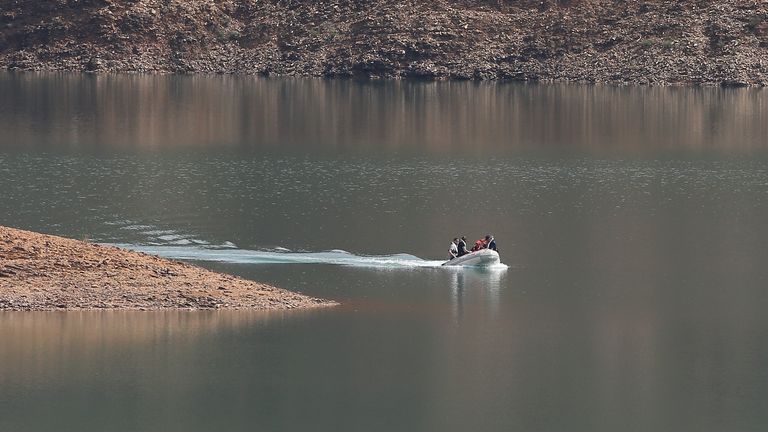 A search dingy navigates in the Arade dam near Silves, Portugal
Pic:AP
