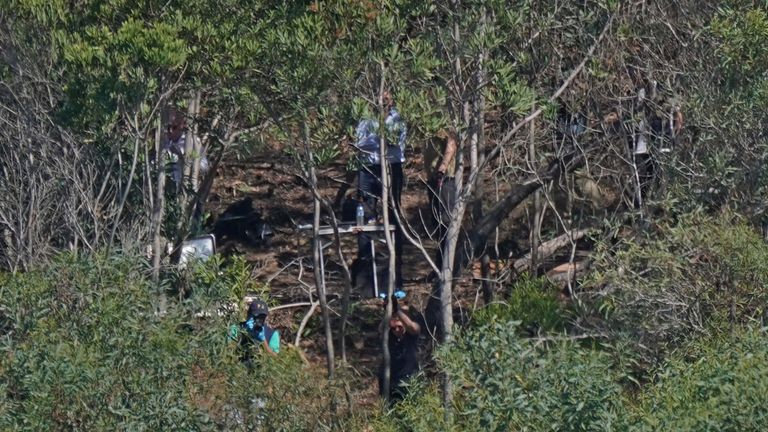 Personnel at Barragem do Arade reservoir, in the Algave, Portugal, as searches continue as part of the investigation into the disappearance of Madeleine McCann. The area is around 50km from Praia da Luz where Madeleine went missing in 2007. Picture date: Thursday May 25, 2023.