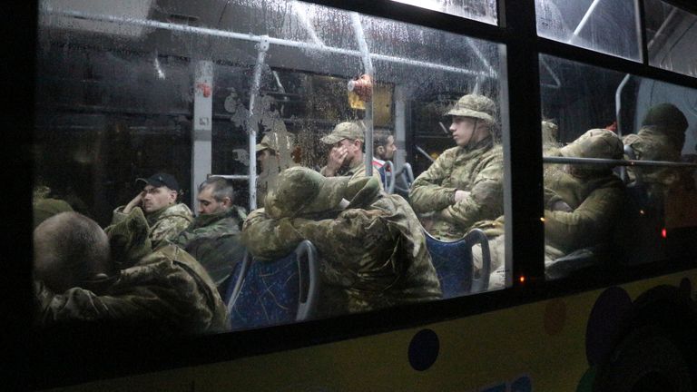 Ukrainian servicemen sit in a bus after leaving Mariupol&#39;s besieged Azovstal steel plant, near a penal colony, in Olyonivka, in territory under the government of the Donetsk People&#39;s Republic, eastern Ukraine, Friday, May 20, 2022. (AP Photo)



