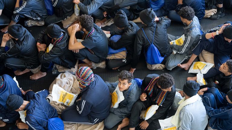 Rescued migrants are waiting for food distribution at the lower deck of the Geo Barents after being processed.