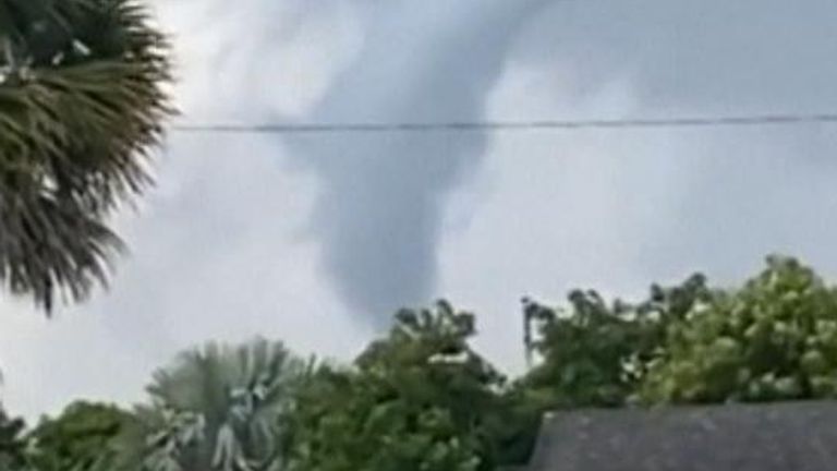 A tornado lasting two minutes hits Miami, accompanied by hailstones