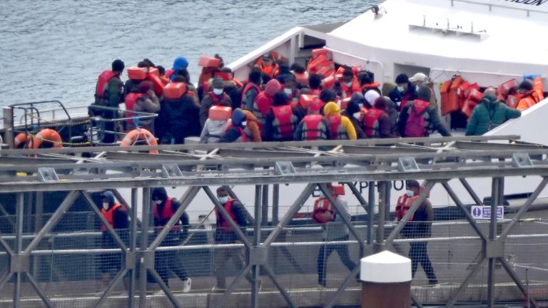 A group of people thought to be migrants are brought in to Dover, Kent