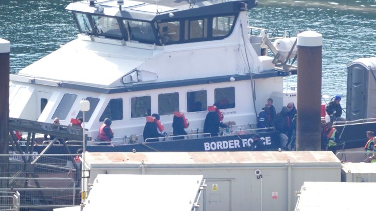 A group of people thought to be migrants are brought to Dover following a small boat incident in the Channel