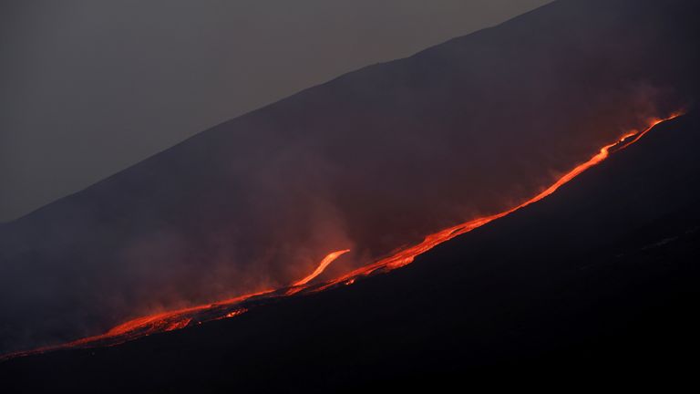 Lava flows downhill as Mount Etna erupts, as seen from Pizzi Deneri on the north side of volcano, on the island of Sicily, in Catania, Italy, May 31, 2022. Picture taken May 31, 2022. REUTERS/Antonio Parrinello/File Photo