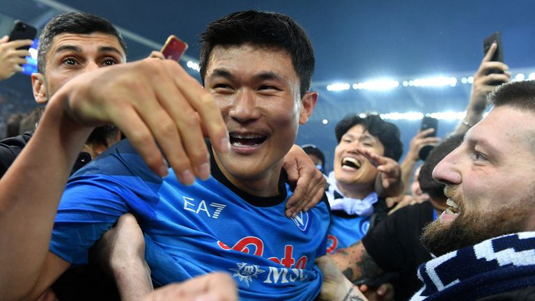 Napoli&#39;s Kim Min-jae celebrates with fans on the pitch