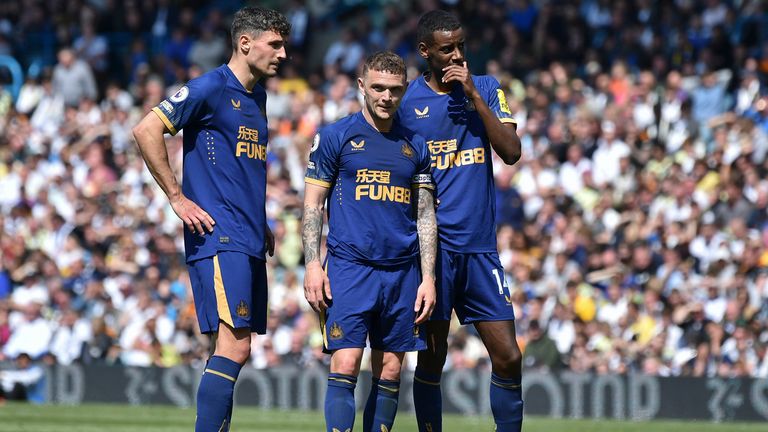 Newcastle&#39;s Kieran Trippier, center, Fabian Schar, left, and Alexander Isak stand before a free kick during the English Premier League soccer match between Leeds United and Newcastle United May 13, 2023. (AP Photo/Rui Vieira)