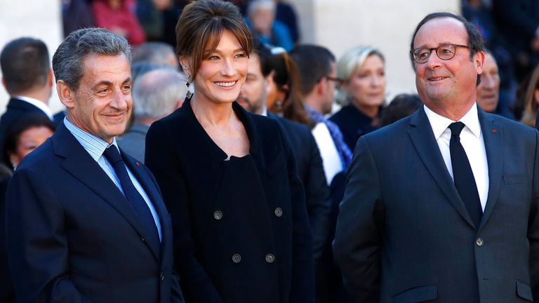 Sarkozy pictured in 2018 with his wife, Carla Bruni Sarkozy, and his successor, former President Francois Hollande Pic: AP 
