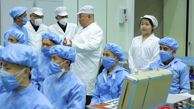 North Korean leader Kim Jong Un and his daughter Kim Ju Ae meet members of the Non-Permanent Satellite Launch Preparatory Committee, as he inspects the country's first military reconnaissance satellite, in Pyongyang, North Korea 