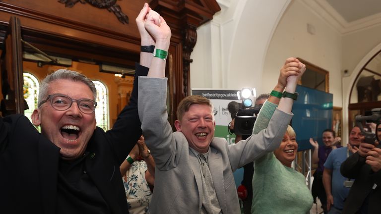 Sinn Fein&#39;s Padraig Donnelly (centre) and Irish Senator Niall ODonnghaile (left) celebrate winning a seat at the Northern Ireland council elections at Belfast City Hall. Picture date: Saturday May 20, 2023.