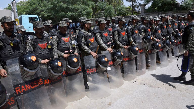 Pakistan&#39;s paramilitary troops with riot gear stand guard outside a court, where Pakistan&#39;s former Prime Minister Imran Khan appearing, in Islamabad, Pakistan, Tuesday, May 9, 2023. Pakistan&#39;s anti-graft agents on Tuesday arrested former Prime Minister Khan as he appeared in a court in the capital, Islamabad, to face charges in multiple graft cases, police and officials from his party said. (AP Photo/Ghulam Farid)
