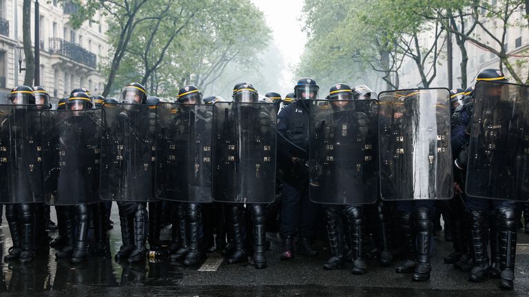 French CRS riot police stand guard during the traditional May Day labour march, a day of mobilisation against the French pension reform law and for social justice, in Paris, France May 1, 2023. REUTERS/Benoit Tessier
