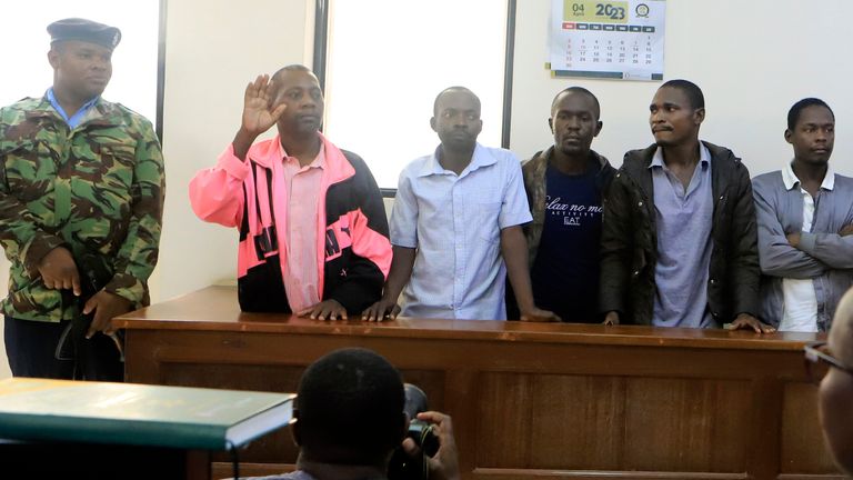 Preacher Paul Mackenzie, second left, leader of the religious commune based in Malindi...s Shakahola forest, appears at Malindi Law Courts, Malindi town, Kenyan Coast Tuesday, May 2, 2023. Mackenzie was arrested for allegedly directing his followers to fast to death in order to meet Jesus. (AP Photo)
