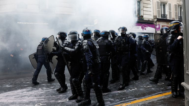 Riot police officers stand guard during the traditional May Day labour march, a day of mobilisation against the French pension reform law and for social justice, in Paris, France May 1, 2023. REUTERS/Benoit Tessier
