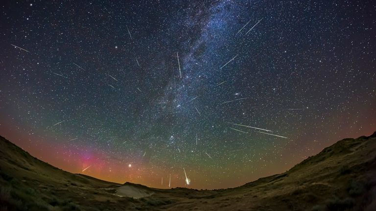 A composite showing about three dozen Perseid meteors accumulated over 3 hours of time, compressed into a single image showing the radiant point of the Perseus meteor shower in 2021.