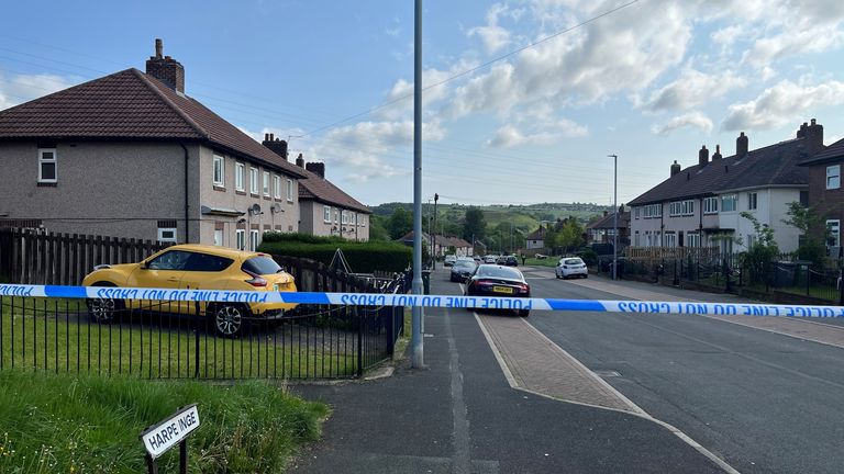 A police cordon on Harpe Inge, Huddersfield, near a property where paramedics found a man and woman with multiple injuries on Monday. A man in his 30s has been arrested by West Yorkshire Police on suspicion of murder after two people were confirmed to have died at the scene. Picture date: Tuesday May 16, 2023.