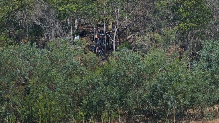 Personnel at Barragem do Arade reservoir, in the Algave, Portugal, as searches continue as part of the investigation into the disappearance of Madeleine McCann. The area is around 50km from Praia da Luz where Madeleine went missing in 2007. Picture date: Thursday May 25, 2023. PA Photo. See PA story POLICE Portugal. Photo credit should read: Yui Mok/PA Wire